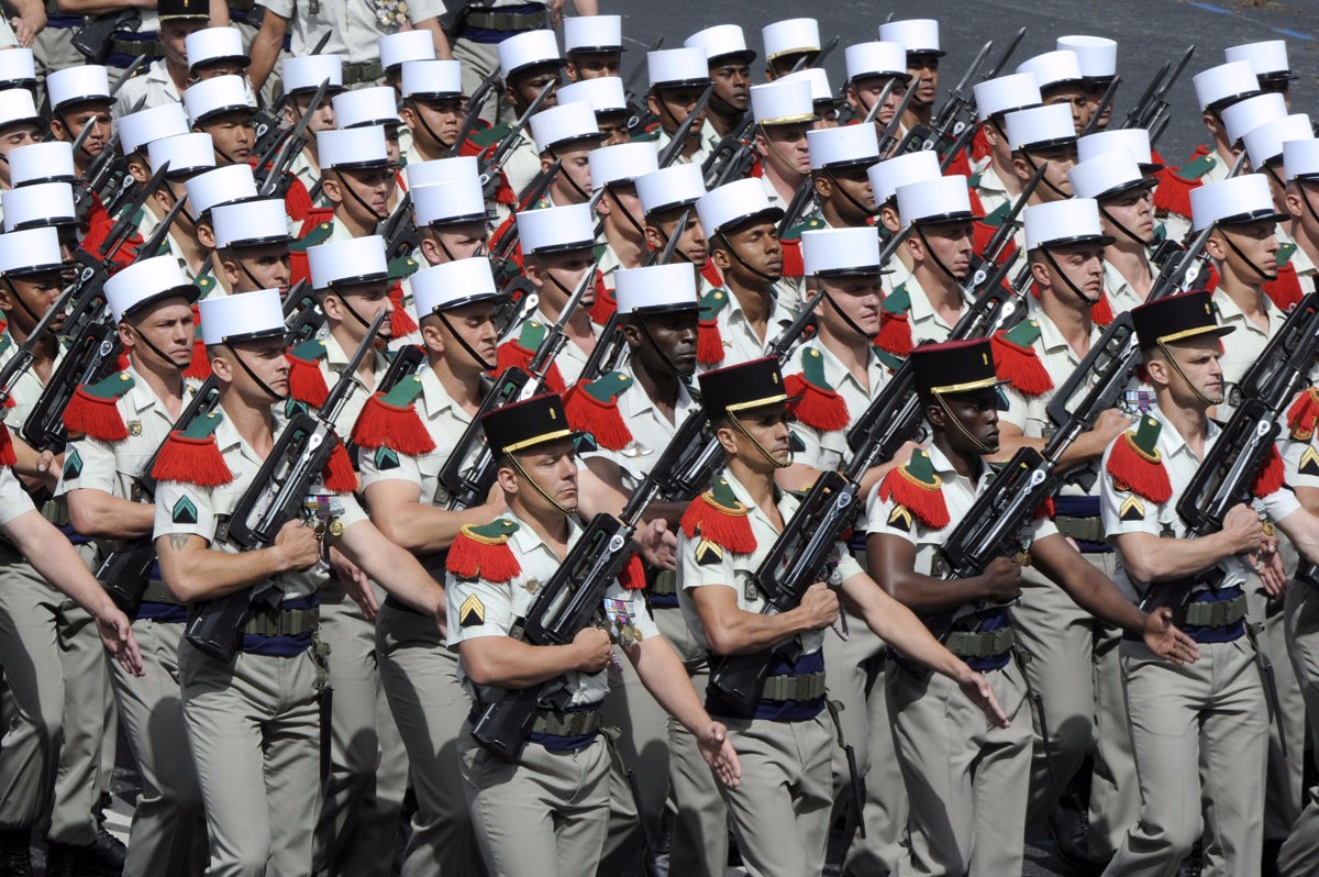 Modern Legionnaires on parade with traditional képi's blanc